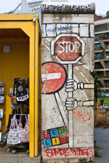 Old telephone box and painted piece of the Berlin Wall, gift shop Berlin loves you, Zimmerstraße,