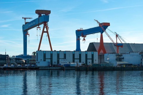 German Naval Yards, shipyard, warehouses, cranes, harbor, Baltic Sea, Kiel Fjord, shipping traffic,