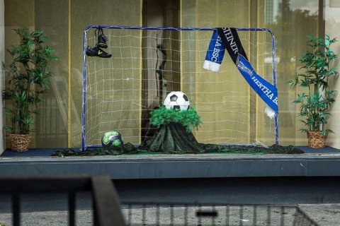 DEU Germany Germany Berlin Display of a discount funeral home on Bundesallee. Ball as an urn for