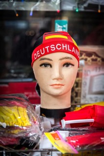 DEU Germany Germany Berlin doll with euro 2016 fan item in a shop window in Neukölln