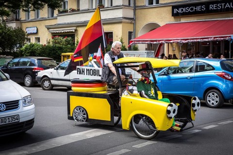 DEU Germany Germany Berlin A man drives through Schöneberg in a self-made European championship