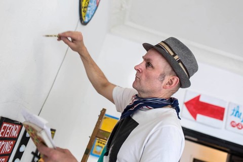 DEU Germany Germany Berlin The artist Jim Avignon setting up an exhibition at the 'Retram' gallery