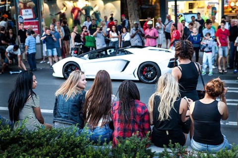 DEU Germany Germany Berlin A Lamborghini sports car is observed or photographed by passers-by on