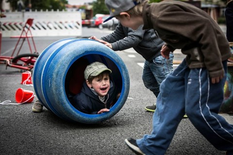 DEU Germany Germany Berlin Children play on Gudvanger Straße, which has been declared the city's