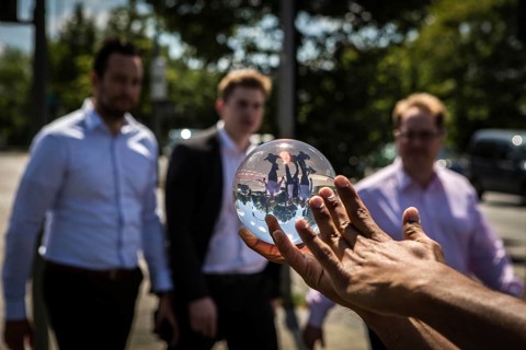 DEU Germany Germany Berlin Juggler with crystal ball works at the intersection opposite the CDU