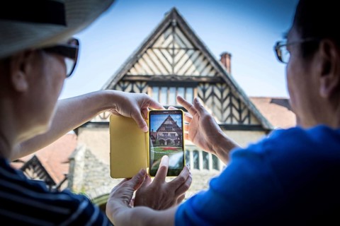DEU Germany Germany Potsdam Tourists photograph the courtyard of the Cecilienhof with the Red Star