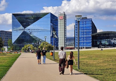 People on their way to Cube Berlin and Berlin Central Station in Spreebogenpark, Germany