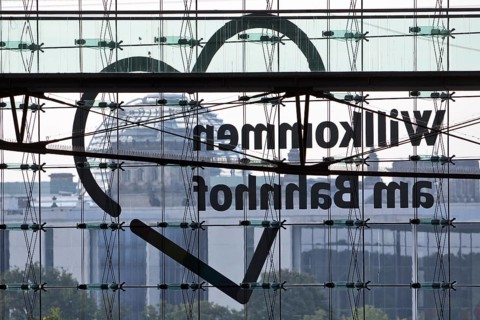 View from Central Station of the Reichstag dome with the inverted lettering Welcome to the Station