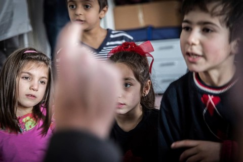 DEU Germany Germany Berlin An animation team entertains refugee children in an asylum center in
