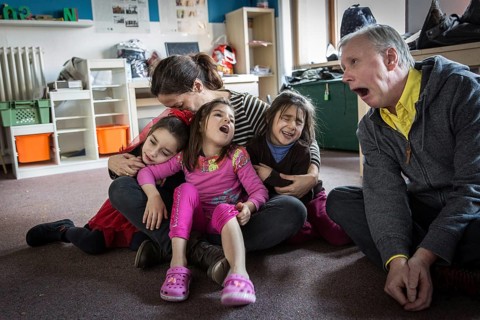 DEU Germany Germany Berlin An animation team entertains refugee children in an asylum center in
