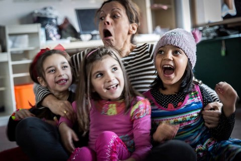 DEU Germany Germany Berlin An animation team entertains refugee children in an asylum center in