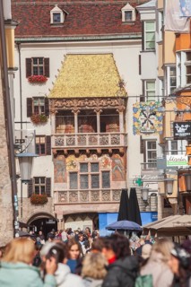 Golden roof, lots of people and historic houses in Herzog-Friedrich-Straße, Altstadt, Innsbruck,