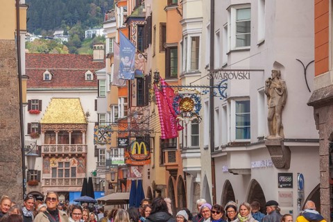 Golden roof, lots of people and historic houses in Herzog-Friedrich-Straße, Altstadt, Innsbruck,