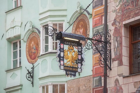 Old hanging sign from Gasthof Goldener Adler in Herzog-Friedrich-Straße, Old Town, Innsbruck,