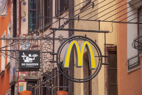 McDonald's hanging sign in Herzog-Friedrich-Straße, Altstadt, Innsbruck, Tyrol, Austria