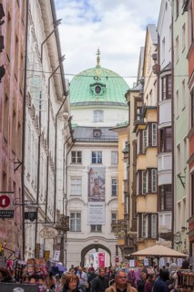 Hofgasse with Hofburg Imperial Palace, historic houses and many people, old town, Innsbruck, Tyrol,