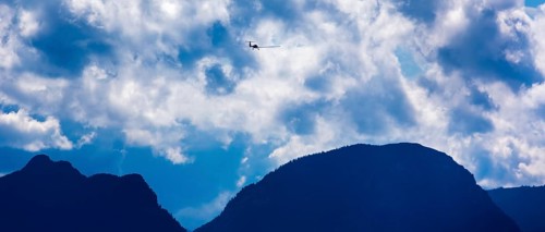 Motorised glider flying over the Alps, Salzburg, Alps, Austria, Europe, aerial view, birds-eyes