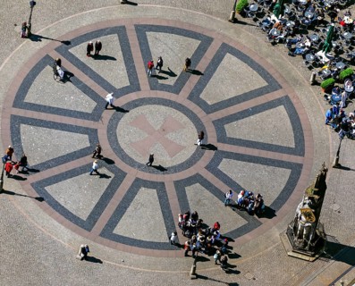 Hanseatic cross in front of the Bremen Roland on the market square of Bremen in front of the town