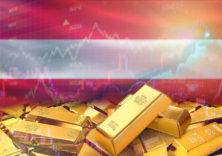 Gold bars on Austria flag in background. Gold bars stacked on Austrian flag. Concept of Austria