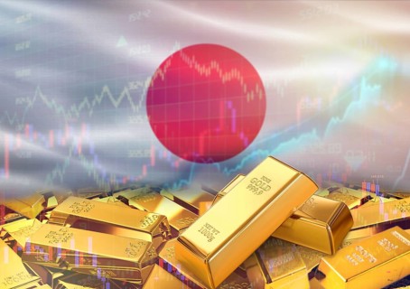 Gold bars on Japan flag in background. Gold bars stacked on Japanese flag. Concept of Japan gold