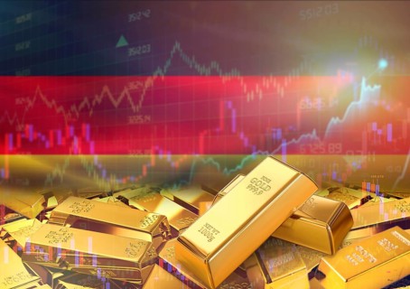 Gold bars on Germany flag in background. Gold bars stacked on German flag. Concept of Germany gold