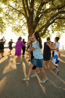 People dancing in the sun, Promenade, Bregenz, Lake Constance, Vorarlberg, Austria