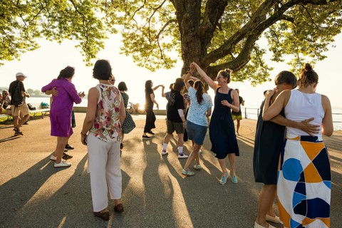 People dancing in the sun, Promenade, Bregenz, Lake Constance, Vorarlberg, Austria