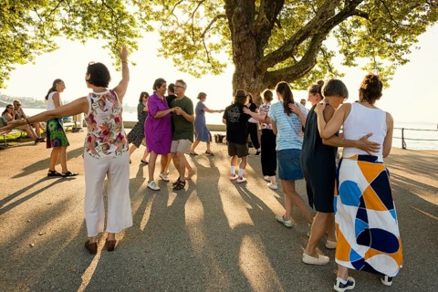 People dancing in the sun, Promenade, Bregenz, Lake Constance, Vorarlberg, Austria