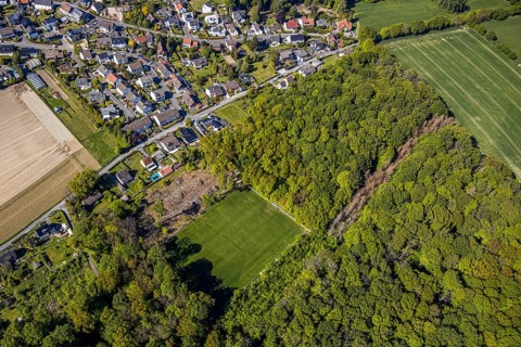 Aerial view, sports field SV Blau-Rot Billmerich e.V., forest deforestation, Unna, Ruhr area, North