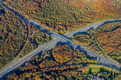 Aerial view, motorway junction Oberhausen, motorway A2, federal road B516, forest area in autumn