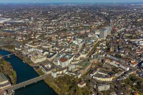 Aerial view, Ruhrbania in the city centre of Mülheim, Ruhr, bridge over the river Ruhe, Protestant