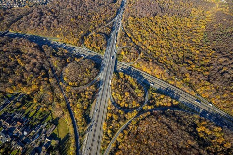 Aerial view, motorway junction Oberhausen, motorway A3, federal road B516, forest area in autumn