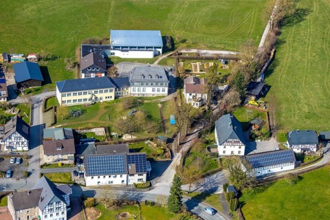 Aerial view, Catholic primary school Helleferld, residential buildings with solar roofs, Hellefeld,