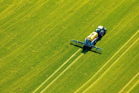 Aerial view, tractor with trailer working in the field, fertilising, Hellefeld, Sundern, Sauerland,