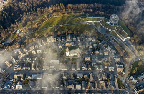 Aerial view, Winterberg centre, Catholic church looking out of the clouds, Oversum Vital Resort,
