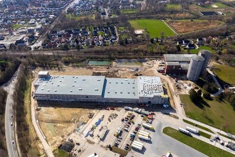 Aerial view, industrial estate northwest, construction site new building logistics hall