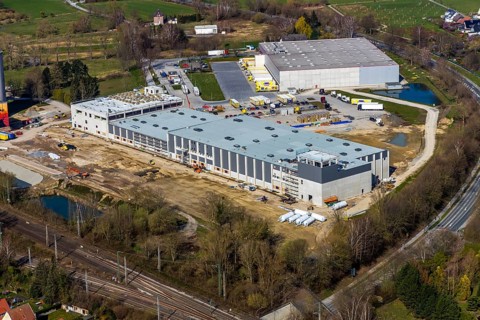 Aerial view, industrial estate northwest, construction site new building logistics hall