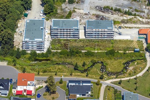 Aerial view, three residential buildings at the renaturalised Soestbach, former outdoor swimming