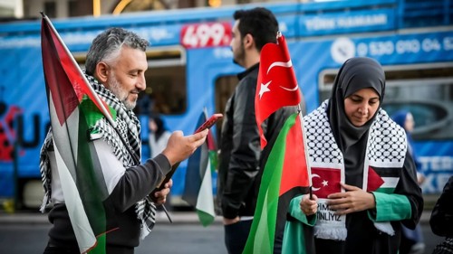 Gaziantep, Türkiye – October 11, 2025: Children and women wearing keffiyehs and carrying
