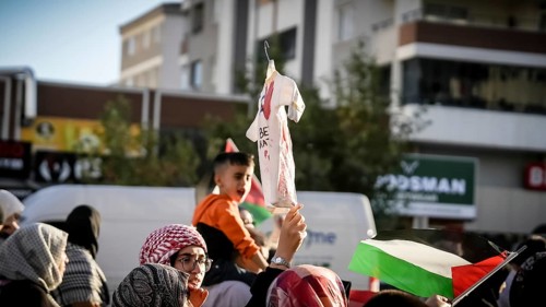 Gaziantep, Türkiye – October 11, 2025: Children and women wearing keffiyehs and carrying