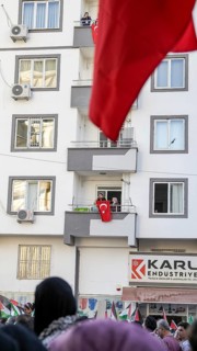 Gaziantep, Türkiye – October 11, 2025: People watch and show support from their balconies as