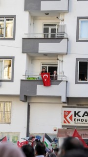 Gaziantep, Türkiye – October 11, 2025: People watch and show support from their balconies as