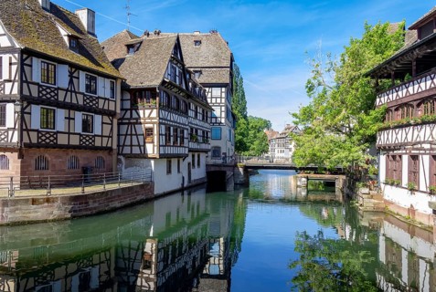 Sunny waterside impression of Strasbourg, a city at the Alsace region in France