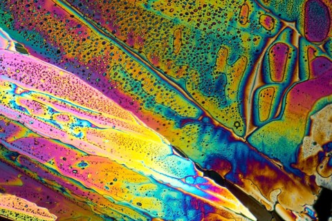 Colorful microscopic shot of Sodium acetate micro crystals in polarized light