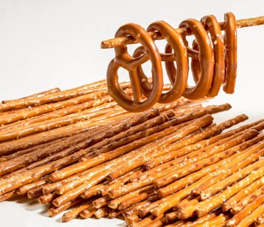 Closeup of some salt sticks and pretzels in light back