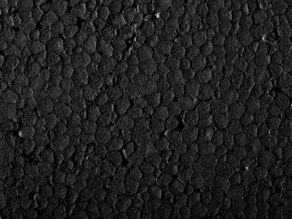 Full frame closeup of a black Polystyrene surface