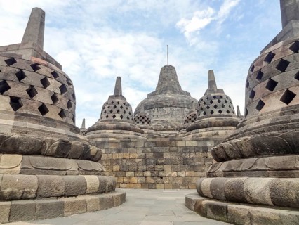 Lots of stupas at a temple named Borobudur located in Java, a island of Indonesia