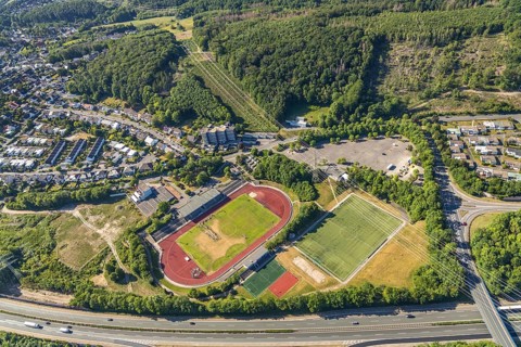 Aerial view, stadium above ground high voltage road, high voltage pylons, planned HStädt. building