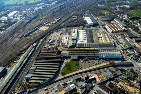 Aerial view, construction site on the WDI site between the railway embankment and