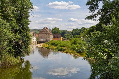 Riparian impression of Berlichingen at river Jagst in southern Germany at summer time